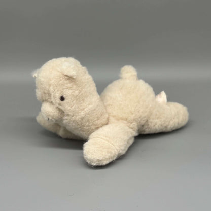 Alpaka Kuscheltier handgemacht aus 100 % Alpakawolle, sitzend in Weiß und Braun, ideal zum Kuscheln.